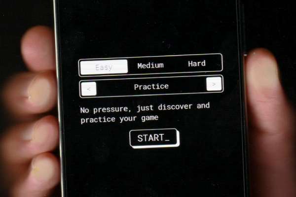 Smartphone held in a hand, displaying the BreakLock home screen with the game options visible.